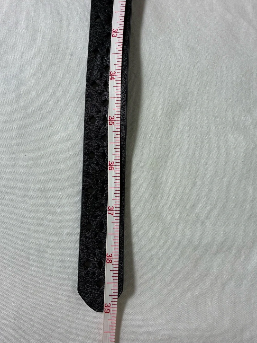 Womens belt Sz Small-Medium black faux leather pierced geometric design